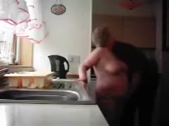 My grandmother and grandfather are seen on a hidden livecam in the kitchen.